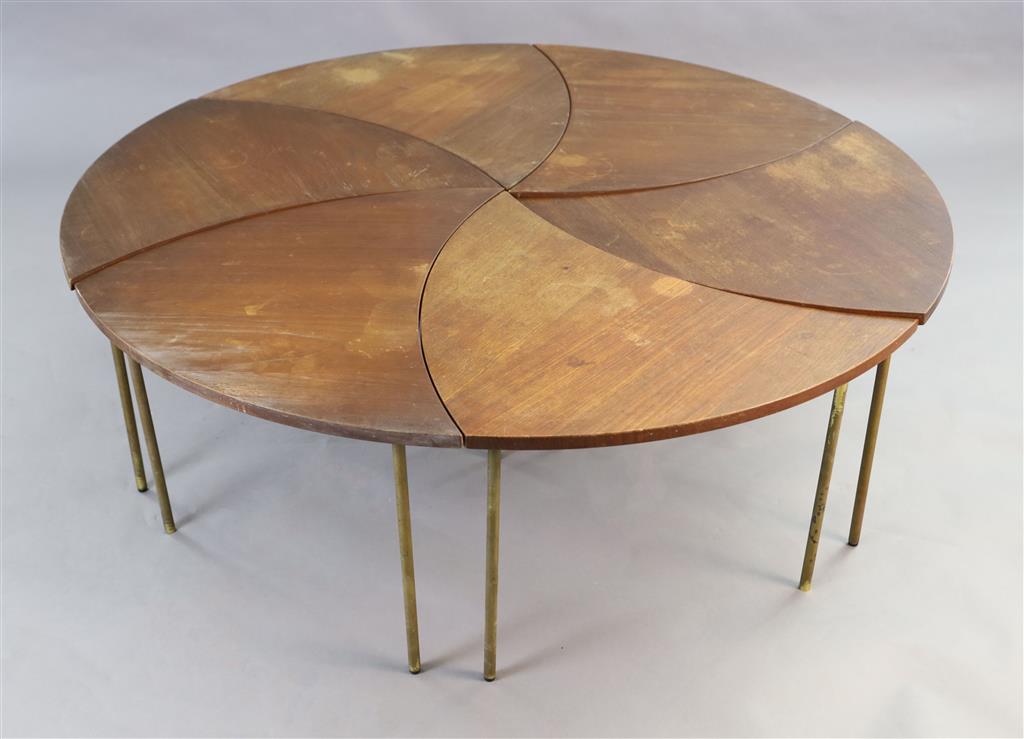 Peter Huidt and Orla Malgaard-Neilson for France & Son. A Danish teak and brass pinwheel modular table in six leaf form sections, c.1